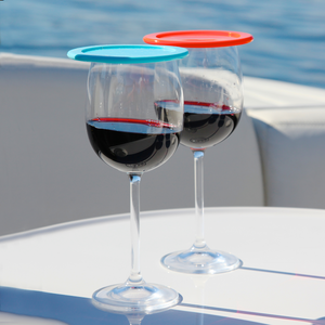 two wine glasses with lids