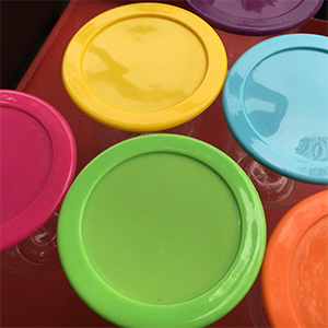 various coloured wine glass lids