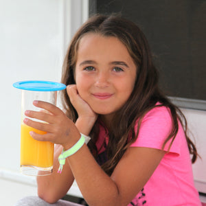 girl holding drinking glass with cover 