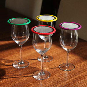 wine glasses with various coloured lids